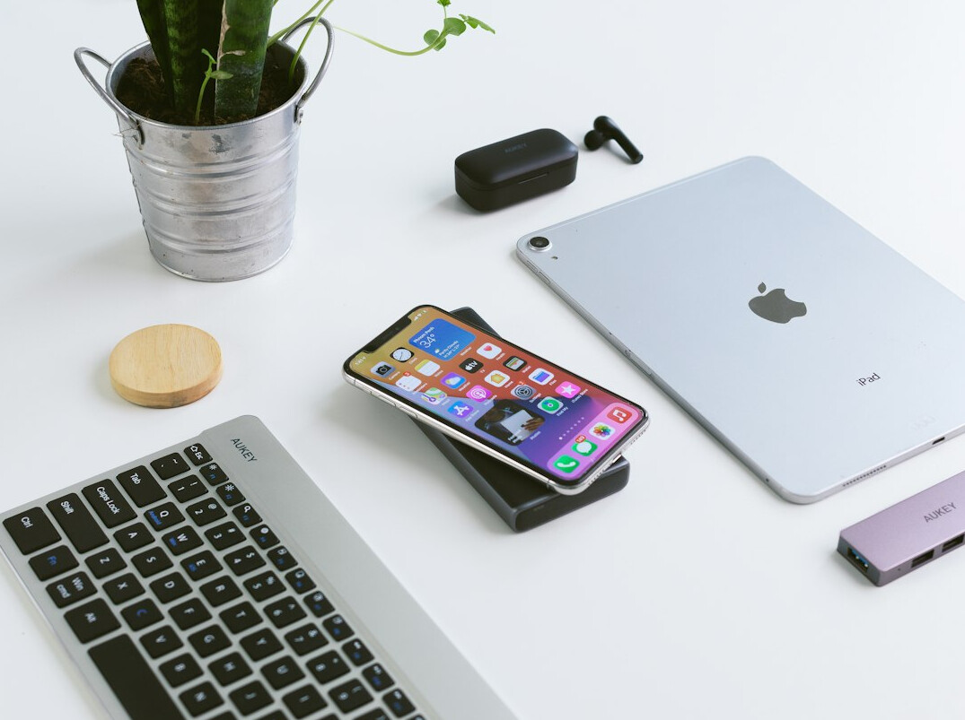 Desk with laptop, tablet and gadgets